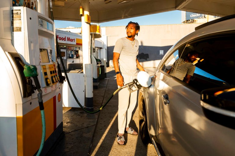 A motorist fills up at a gasoline station in San Francisco, where regular unleaded gasoline was selling for $5.85 per gallon. 