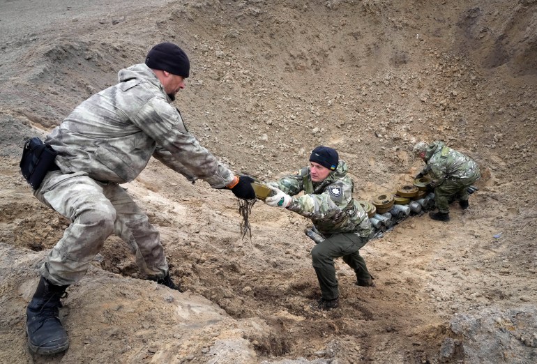 Sappers collecting explosives
