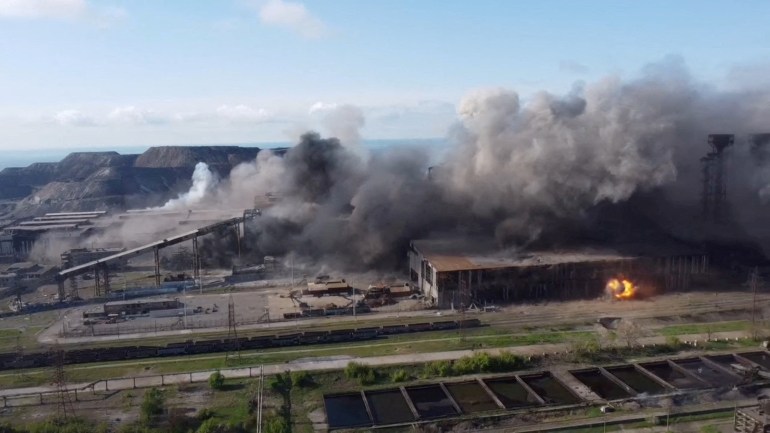An aerial view shows shelling in the Azovstal steel plant complex, amid Russia's invasion of Ukraine, in Mariupol, Ukraine, in this screen grab taken from a handout video released on May 5, 2022.