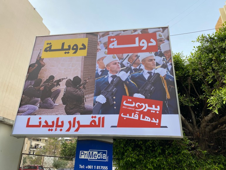 Campaign billboard by MP and billionaire businessman Fouad Makhzoumi’s electoral list critical of Iran-backed Hezbollah. Beirut, Lebanon. 2 May 2022 (Kareem Chehayeb/Al Jazeera)