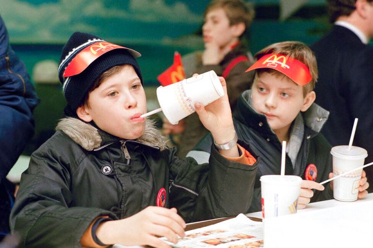 Young Muscovites checks out a new taste sensation for the Soviet Union, hamburgers and soft drinks in Moscow on Jan. 31, 1990