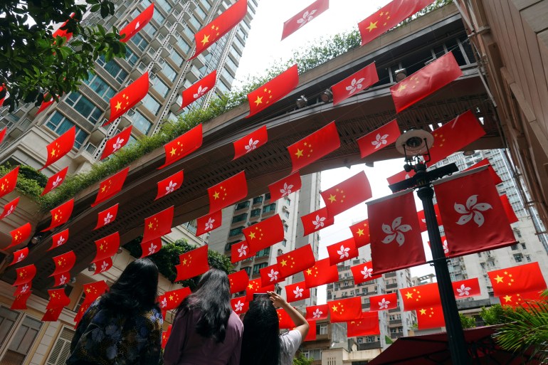 Hong Kong flags hang at an arcade