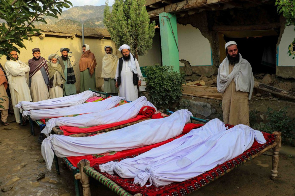 People attend funeral of the victims of earthquake in Gayan village