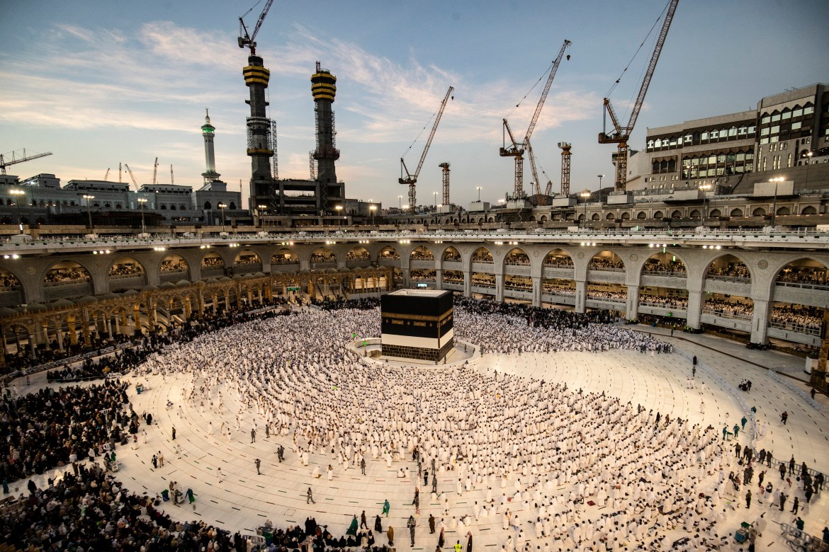 Muslim pilgrims pray around the Kaaba