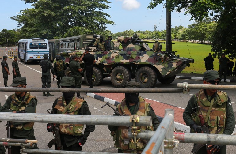 Sri Lanka army soldiers stands guard near the parliament building in Colombo.
