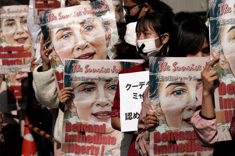 Myanmar people holding posters of Aung San Suu Kyi during a demonstration in Tokyo, Japan.