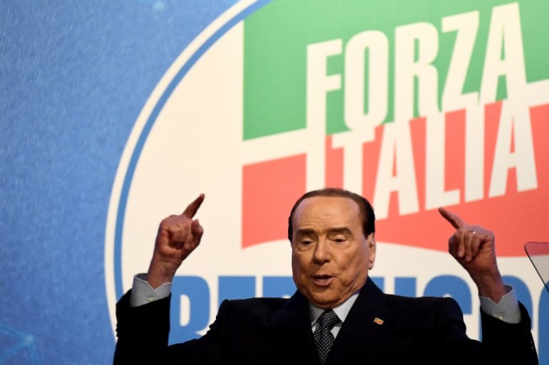 Former Italian Prime Minister and leader of the Forza Italia party Silvio Berlusconi gestures during a rally in Rome