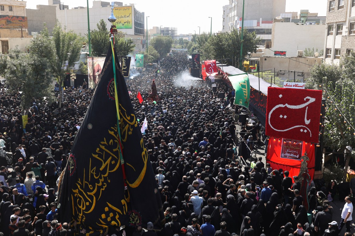 Iranians walk as they commemorate Arbaeen in Tehran.
