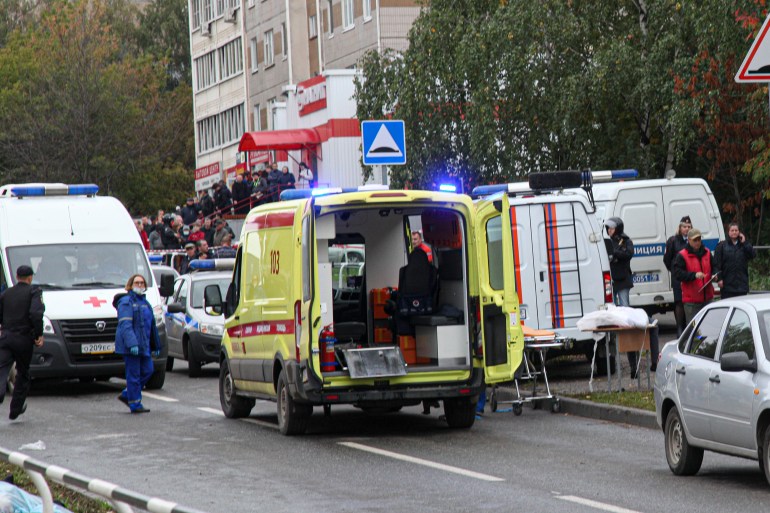 Police and paramedics work at the scene of a shooting at school No. 88 in Izhevsk, Russia