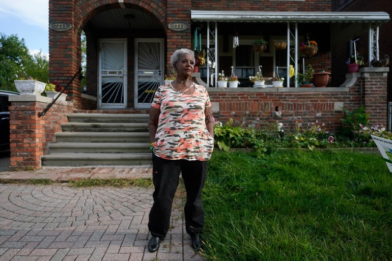Pamela Jackson-Walters stands outside her home in Detroi