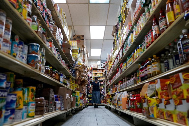 A woman shops for groceries at El Progreso Market in the Mount Pleasant neighborhood of Washington, D.C., U.S