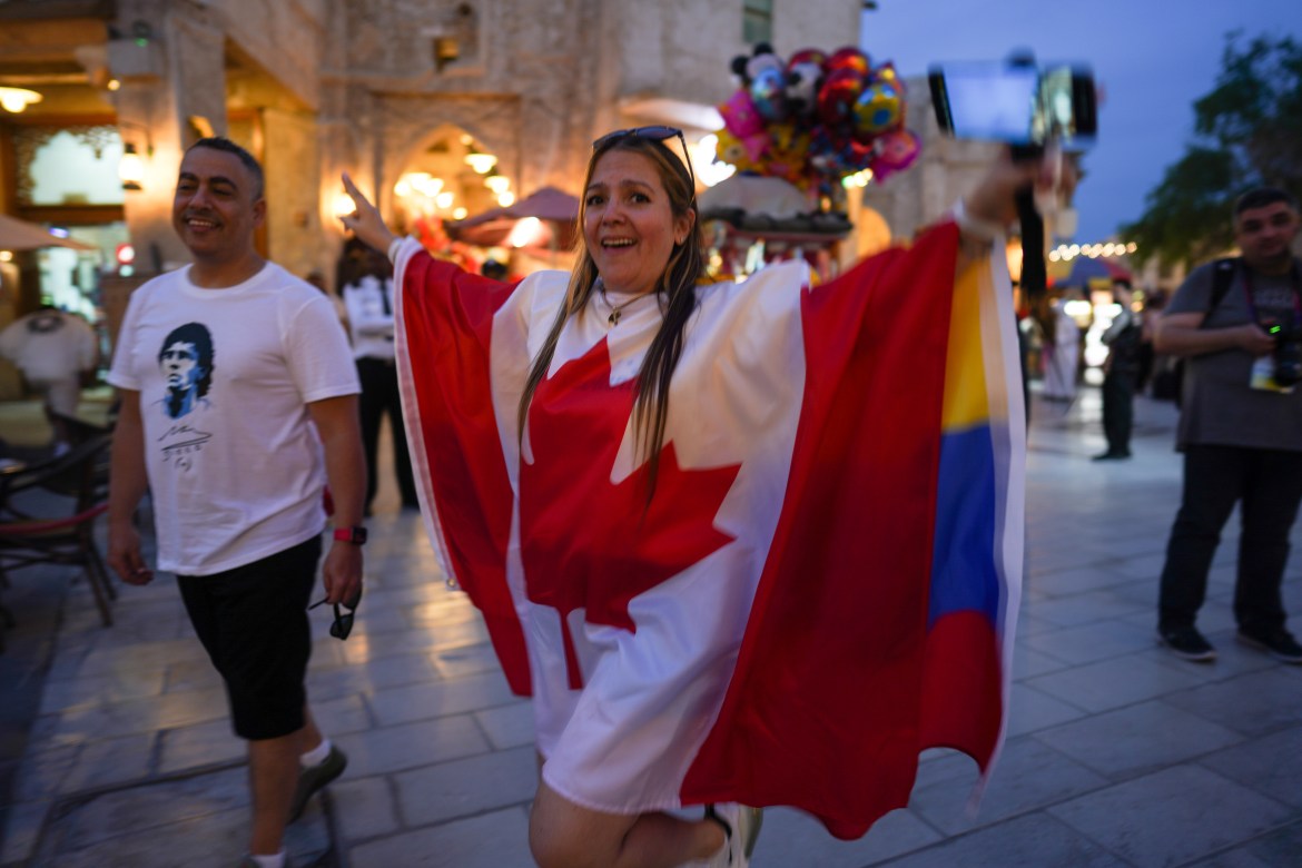 A woman wearing a Canadian flag