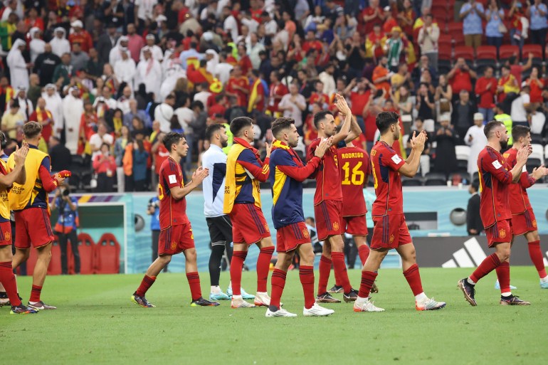 Spanish players clap after their match against Germany in Group E of the FIFA World Cup 2022.