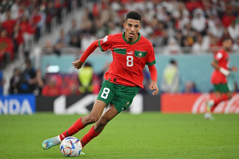 Morocco's midfielder Azzedine Ounahi runs with the ball during the quarterfinal football match between Morocco and Portugal.