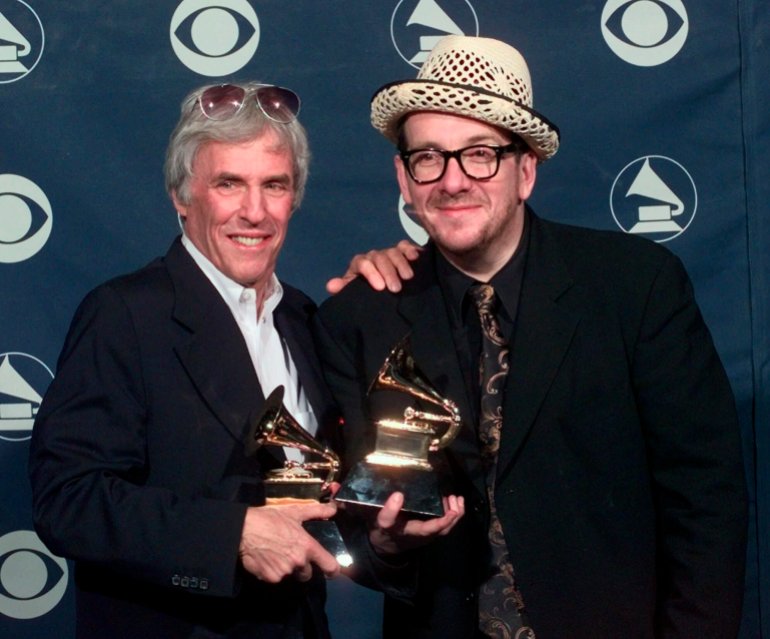 Burt Bacharach, left, and Elvis Costello hold their awards