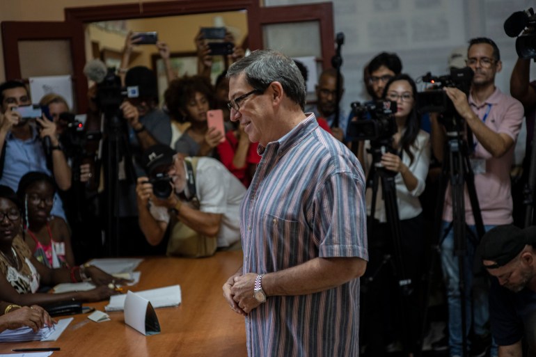 Cuba's Foreign Minister Bruno Rodriguez prepares to vote at a polling station in Havana, Cuba, Sunday, March 26, 2023. Cubans vote for the deputies that will make up the People's Power National Assembly, a unicameral parliament. (AP Photo/Ramon Espinosa)