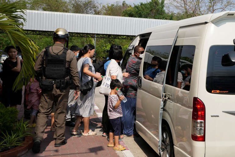 Members of the Shenzhen Holy Reformed Church, also known as the Mayflower Church, leave from the Nongprue police station on their way to Pattaya Provincial Court in Pattaya, Thailand