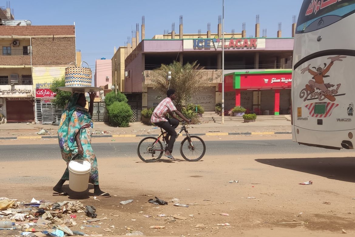 A man rides a bicycle on al-Sittin (sixty) road in Khartoum