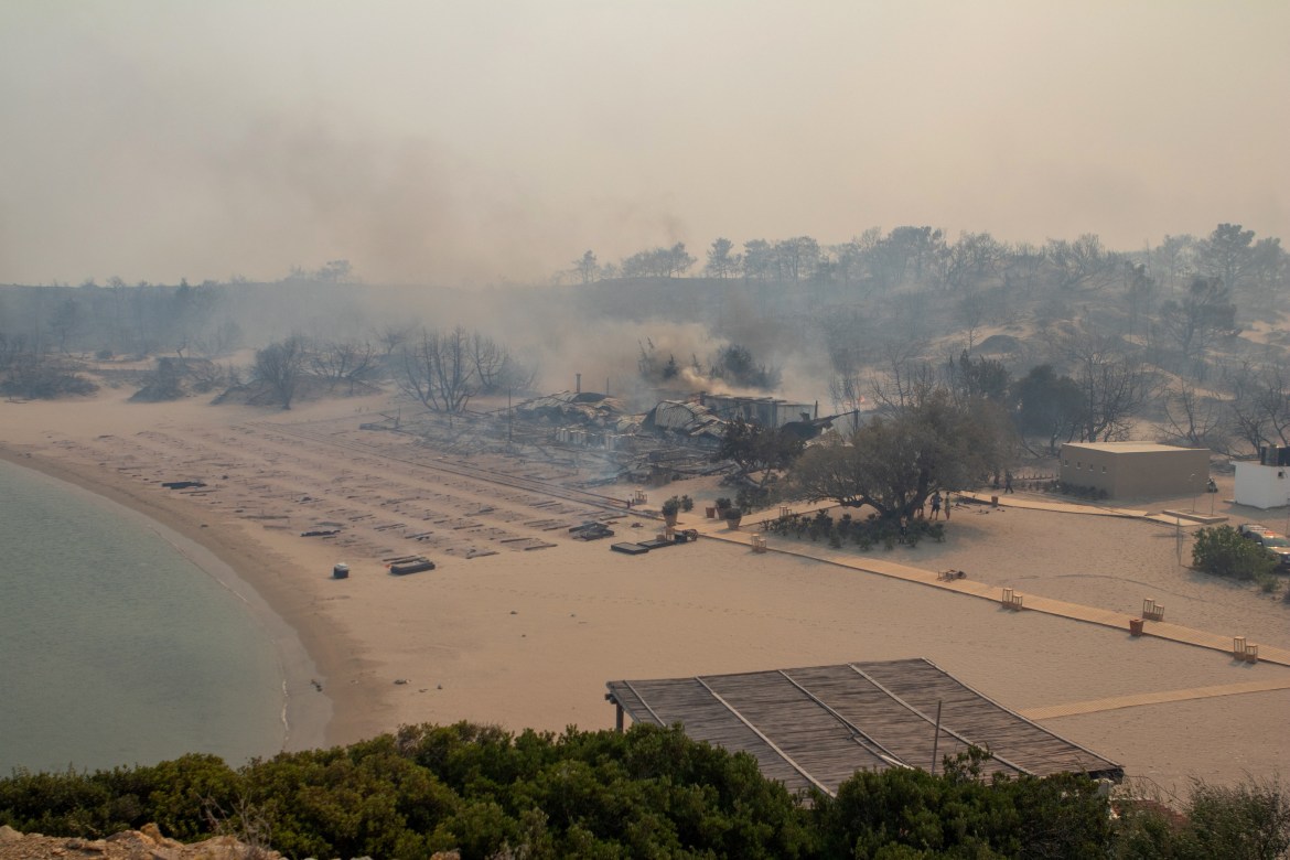 general A wildfire burns subsequent to a sea trudge plan Lindos,
