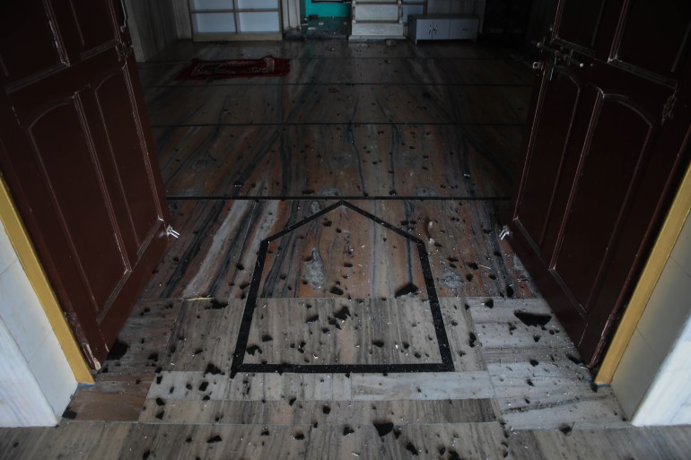 Glass shards scattered on the prayer floor of Shahi Jama Masjid
