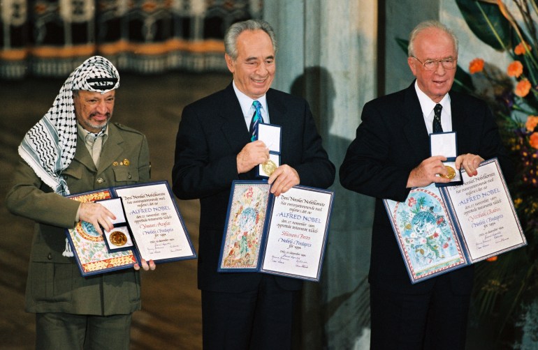 File photograph of Palestinian President Arafat, Israel's Perez and Israeli Prime Minister Rabin showing their Nobel Peace Prize in Oslo