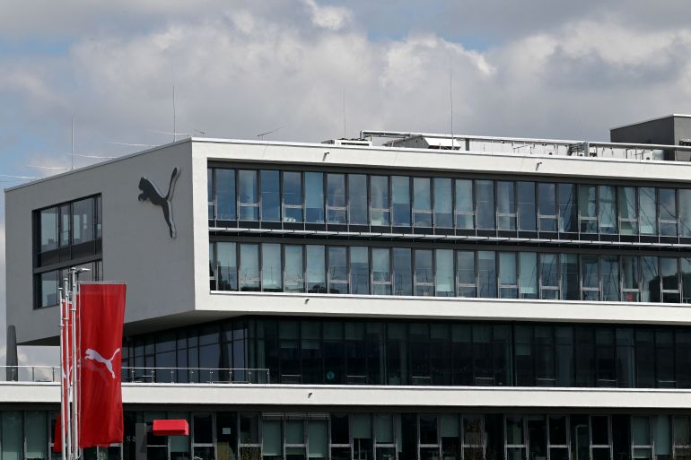 The logo of Germany's sportswear maker Puma is seen on the company headquarters in Herzogenaurach, southern Germany, on April 21, 2022. (Photo by Christof STACHE / AFP)