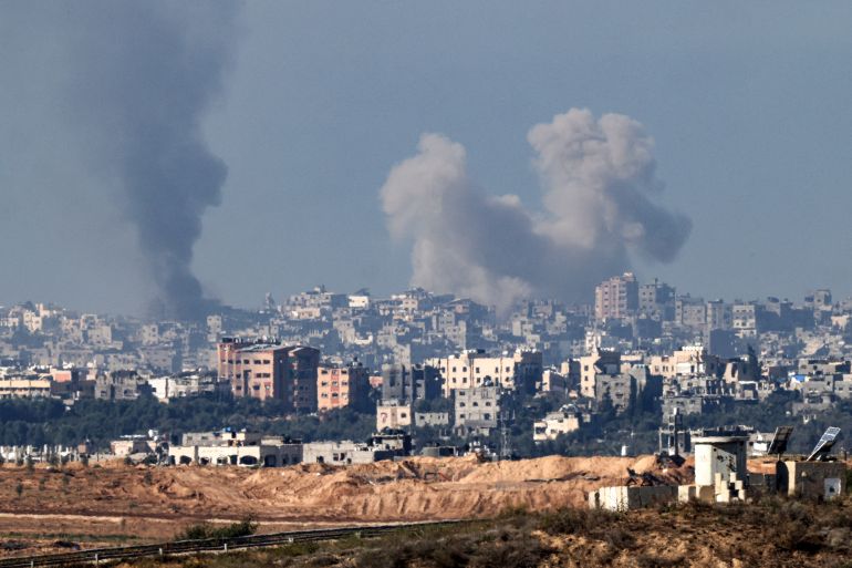 Smoke billows over the northern Gaza Strip during Israeli bombardment from southern Israel on December 15