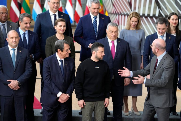 European Council President Charles Michel, front right, speaks with Ukraine's President Volodymyr Zelenskyy, front second right, and Hungary's Prime Minister Viktor Orban, second row center, as they pose with other European Union leaders for a group photo at an EU summit in Brussels on Thursday, Feb. 9, 2023. [AP Photo/Virginia Mayo, File]
