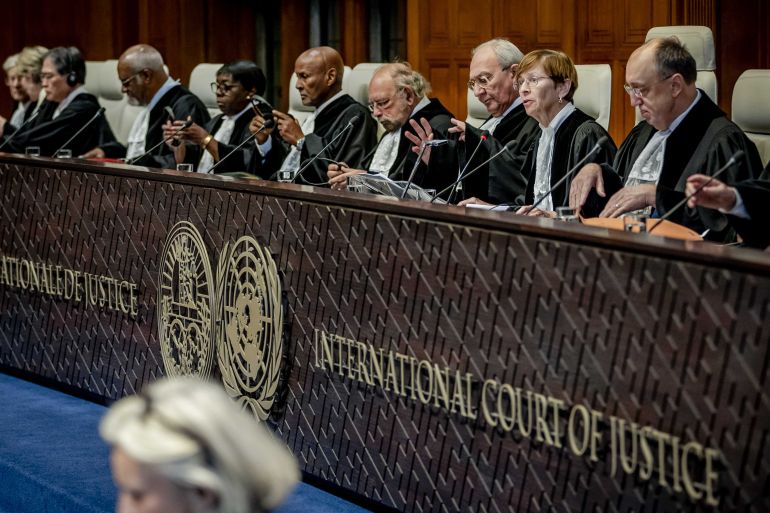 Joan Donoghue (2-R), President of the International Court of Justice and other judges at the International Court of Justice