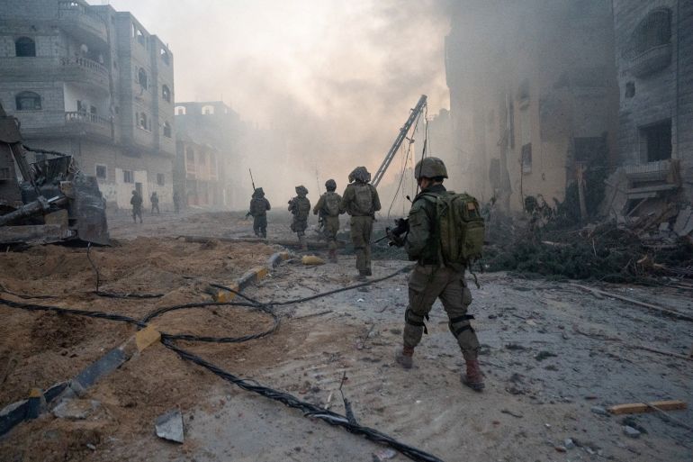 Israeli soldiers operate in the Gaza Strip amid the ongoing conflict between Israel and the Palestinian Islamist group Hamas