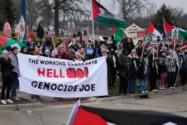 Pro-Palestinian demonstrators march during a February 1 visit by US President Joe Biden to Warren, Michigan, the United States [AP/Paul Sancya]