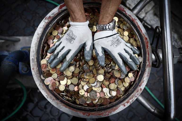 Coins are pictured after having been collected from the Trevi Fountain