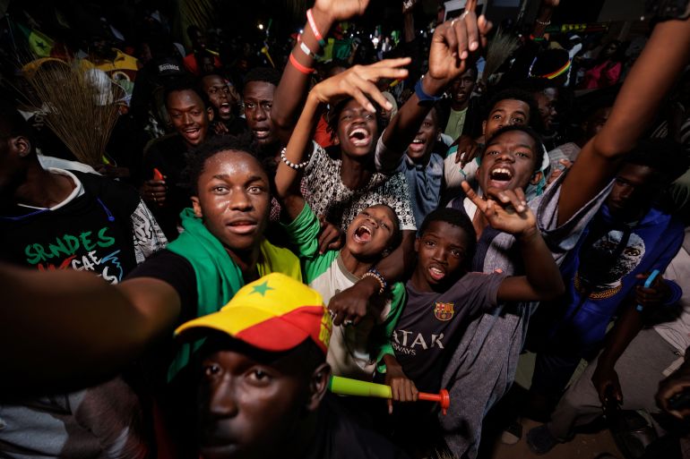 Supporters of Senegalese presidential candidate Bassirou Diomaye Faye celebrate early results
