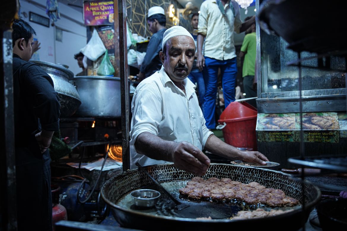 A chef prepares galouti kebab from minced meat and spices. [Meer Faisal/Al Jazeera]