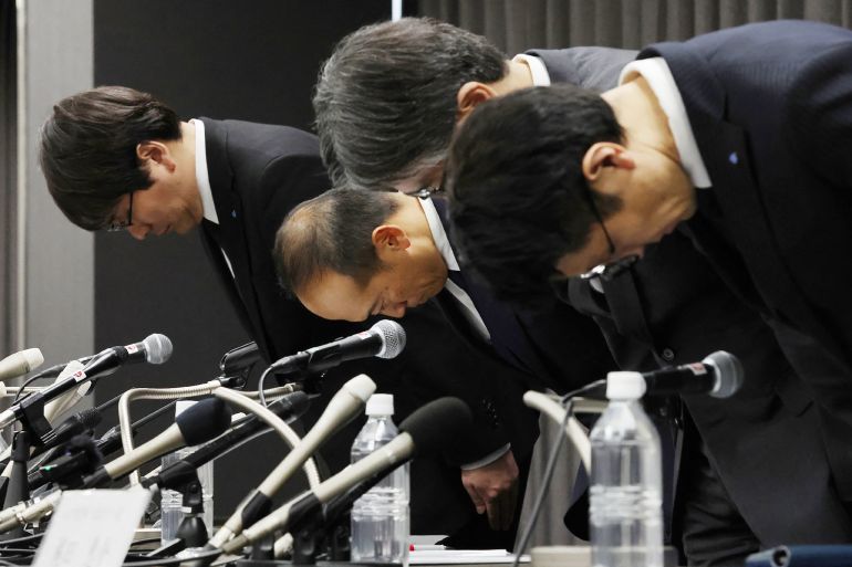 Officials of Kobayashi bow in apologies at a press conference