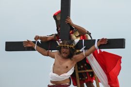 Ruben Enaje performs his 35th re-enactment of the crucifixion of Jesus Christ on Good Friday in San Fernando, Pampanga province. [Jam Sta Rosa/AFP]