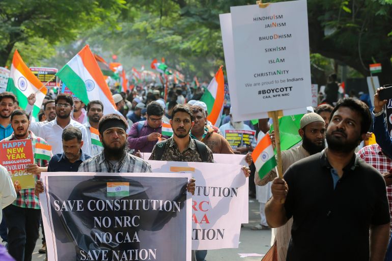 Indians hold placards as they march during a protest against a new citizenship law that opponents say threatens India's secular identity in Hyderabad, India, Saturday, Jan. 4, 2020. The new citizenship law and a proposed National Register of Citizens have brought thousands of protesters out in the streets in many cities and towns since Parliament approved the measure on Dec. 11, leaving at least 23 dead in clashes between security forces and the protesters. (AP Photo/Mahesh Kumar A.)