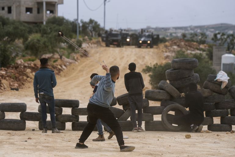 Protest at settler march (AP Photo/Majdi Mohammed)