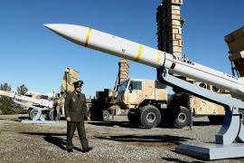 Iran&#039;s Defence Minister Brigadier General Mohammad-Reza Ashtiani walks near an Iranian missile during an unveiling ceremony in Tehran, Iran, in this picture obtained on February 17, 2024 [Handout: Ministry of Defence and Armed Forces Logistics via Reuters]