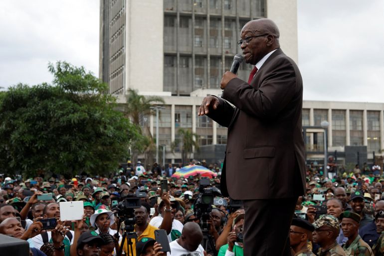 Former South African President Jacob Zuma speaks to supporters of the uMkhonto weSizwe Party outside the High Court in Durban