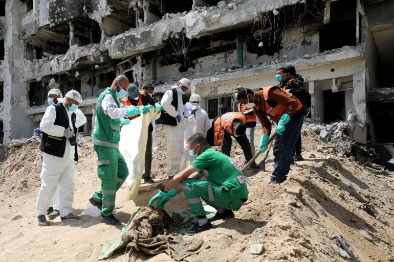 Rescuers and medics search for dead bodies inside the damaged Al Shifa Hospital after Israeli forces withdrew from the hospital