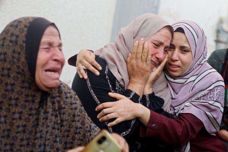 Women mourn near the bodies of Palestinians killed in Israeli strikes, amid the ongoing conflict between Israel and the Palestinian Islamist group Hamas, in Rafah, in the southern Gaza Strip, April 21