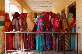 People queue to vote at a polling station during the second phase of the general elections, in Barmer, Rajasthan [Adnan Abidi/Reuters]