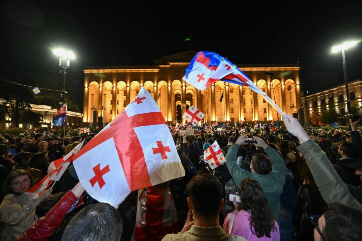 Georgian pro-democracy groups activists protest against a repressive "foreign influence" bill outside the parliament