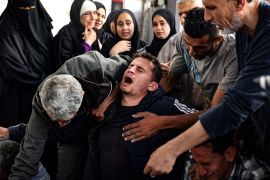 A Palestinian man mourns relatives killed in Israeli bombing on Rafah [AFP]