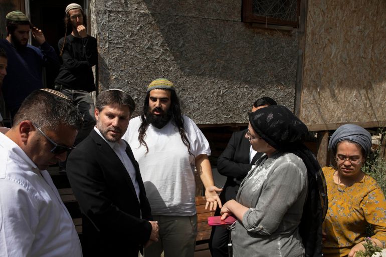 Israeli Knesset members Bezalel Smotrich, second left, visits a house in the Sheikh Jarrah neighborhood of East Jerusalem
