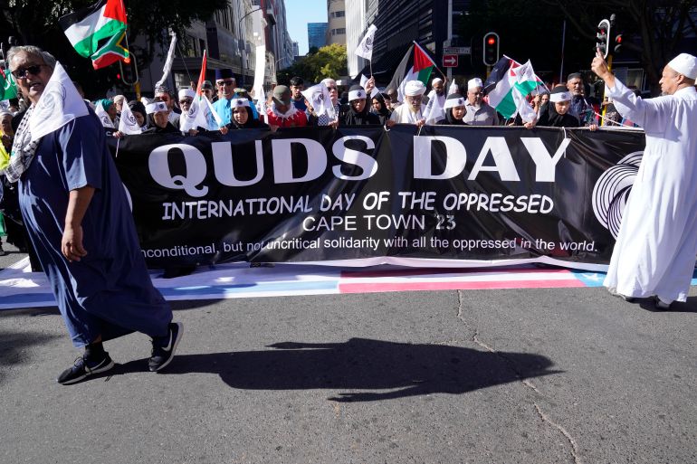 Quds Day banner held by demonstrators