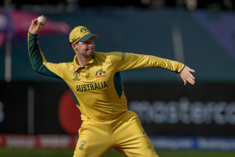 Australia's Steve Smith throws a cricket ball.