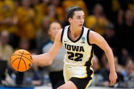 Iowa guard Caitlin Clark drives up court in a college basketball game against West Virginia in the NCAA Tournament, on March 25, 2024 in Iowa City, US [Charlie Neibergall/AP Photo]