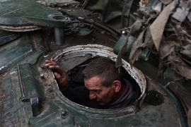 A Ukrainian soldier preparing for his next operation near the front line in Zaporizhia region [Andriy Andriyenko/AP Photo]